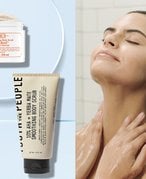 Person in shower using a body scrub