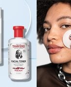 Person applying toner to their cheek