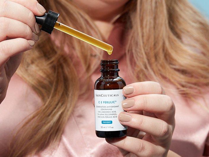 Picture of a person’s hands holding the SkinCeuticals C E Ferulic with 15% L-Ascorbic Acid